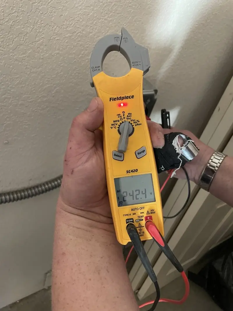 Voltage testing with clamp meter during Outlet Installation in Woodcrest